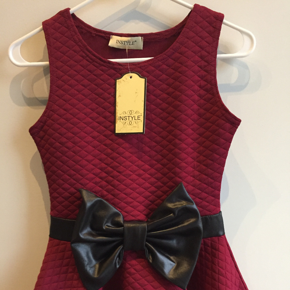 Quilted peplum top with vegan leather bow, NWT